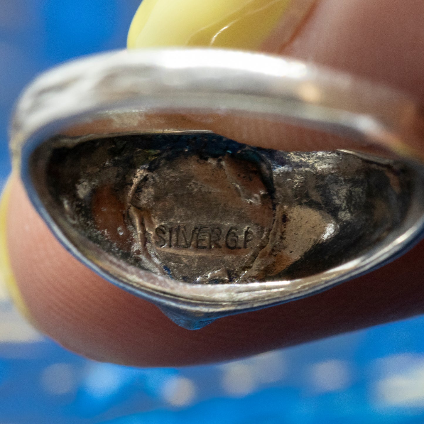A close-up inside the ring, showing the stamp which reads "SILVER G.P".