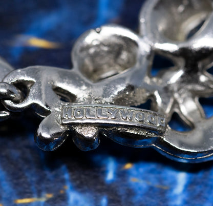 A close-up of the back of the necklace, showing the maker's mark which reads "HOLLYWOOD".